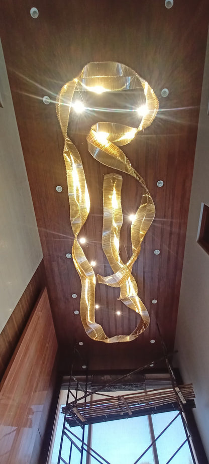 Aurora Drift – Sculptural Glass Chandelier in Amber & Metal